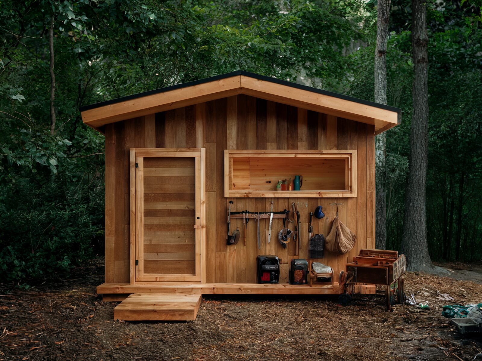 Plastic, wood, and metal sheds side by side